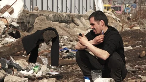 A refugee is shaving Stock Footage 188427876