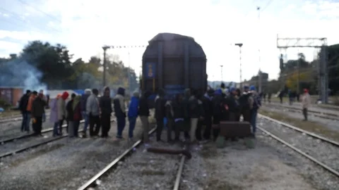 Refugees and migrants wait on the Greece-Macedonia border near Idomeni Stock-Footage 99181786
