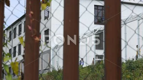The refugees in the detention camp for razor fence Stock Photos