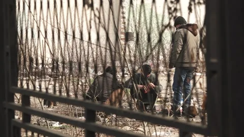 Refugees preparing food Stock Footage 174248670