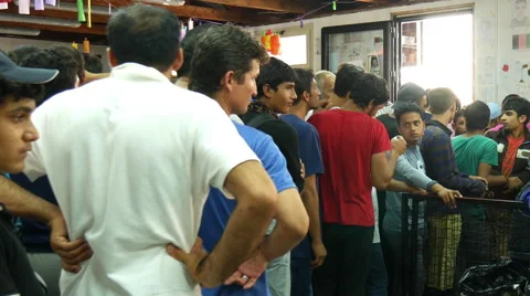 Refugees queuing in a help center in Belgrade Stock Footage 68042174