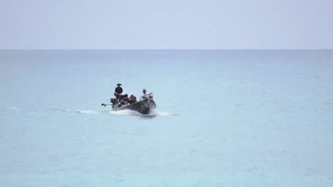 Refugees sailing in a boat Stock Footage 168096587