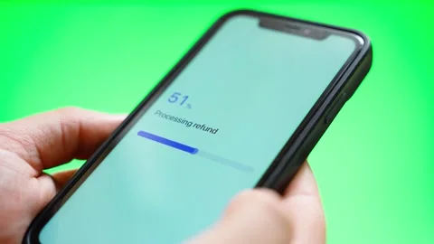 Refund processing on smartphone screen ends with refund declined against green Video stock 342603254