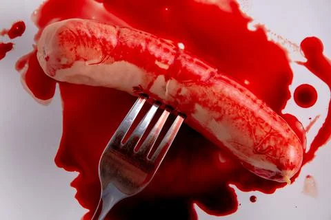 Refusal to eat animals concept: bleeding sausage Stock Photos