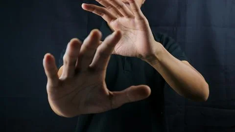 Refusal gesture hands on black background. refused to be invited. rejection.. Stock Photos