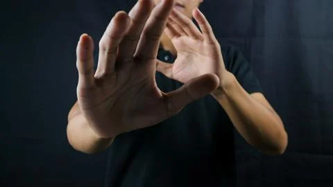 Refusal gesture hands on black background. refused to be invited. rejection.. Stock Photos