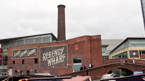 Regency Warf Building, Birmingham, UK, people crossing bridge, Canal. Stock Footage 132706992