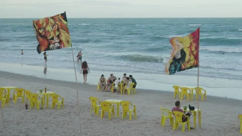 Reggae Flags Waving on Windy Beach in Canoa Quebrada Stock Footage 327722210