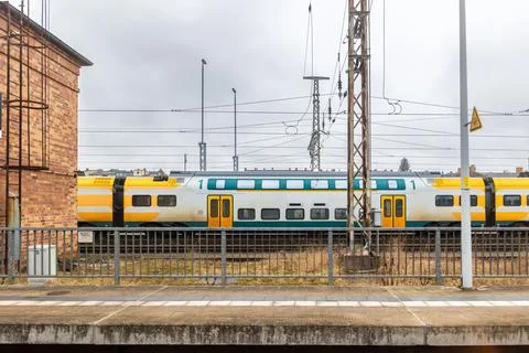 Regional double decker train stops at the station platform. Urban transit a.. 스톡 사진