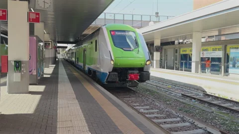 Regional train arriving at platform at Milano Porta Garibaldi station Stock Footage 335205095