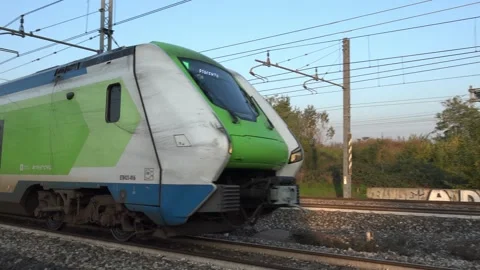 Regional train ETR 421-016 of Trenord travelling towards Piacenza on the rai Stock Footage 292639695