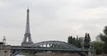 Regional Train Passing on Bridge in Paris City and Eiffel Tower Famous Landmark 4k or 4k+ Resolution