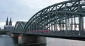 Regional Train Passing Crossing Hohenzollern Bridge Cologne Cityscape Landmarks HD Footage