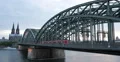 Regional Train Passing Crossing Hohenzollern Bridge Cologne Cityscape Landmarks 4k or 4k+ Resolution