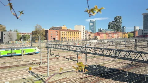 Regional train passing railway tracks near Milano Porta Garibaldi in Milan Stock Footage 335204948