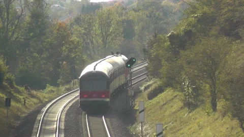 Regional Train Red Old to Kaufering Bavaria Landscape with Pollen in the sunset Stock Footage 310450351