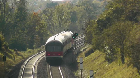 Regional Train Red Old to Kaufering Bavaria Landscape with Pollen in the sunset Stock Footage 332070311