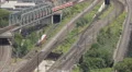 Regional Trains Passing Over Bridge Aerial View Passengers Commuters Commuting HD Footage
