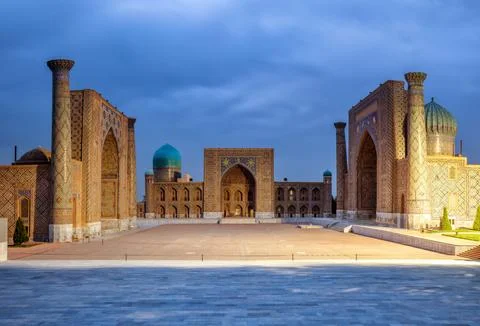Registan square at evening Stock Photos