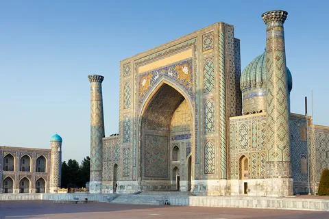 Registan Square in Samarkand featuring the Sher-Dor Madrasah with its ornat.. Фото