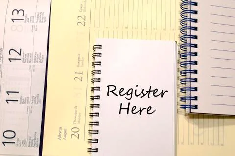 Register here write on notebook Stock Photos