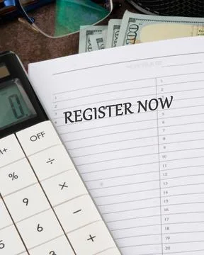 REGISTER NOW words written in the notebook, vertical photo Stock Photos
