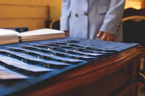 Registration desk table, process of checking in on a conference congress fo.. Stock Photos