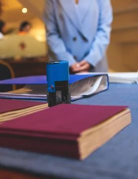 Registration desk table, process of checking in on a conference congress fo.. Stock Photos