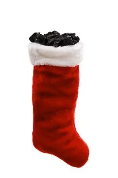 Regular Christmas stocking with coal and plain background Foto stock