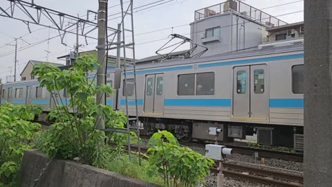 Regular JR  train is passing through neighbourhood in Kyoto. Japan Vídeo Stock 341006101