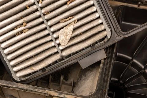 Regular maintenance of the cars engine includes replacing the air filter Stock Photos
