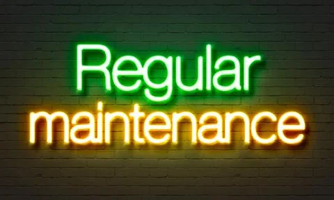Regular maintenance neon sign on brick wall background. Illustrazione stock