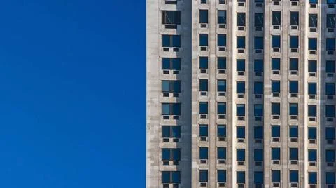 Regular pattern made of rectangular windows on block of flats / offices bu... Stock Photos