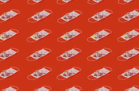 Regular Pattern Of Medical Face Masks Zenith View With Flowers And Red Backgr Stock Photos