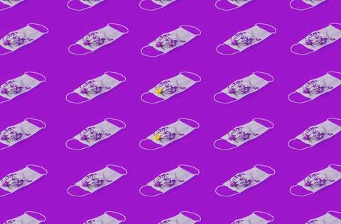 Regular Pattern Of Medical Face Masks With Flowers And Purple Cancer Related Stock Photos