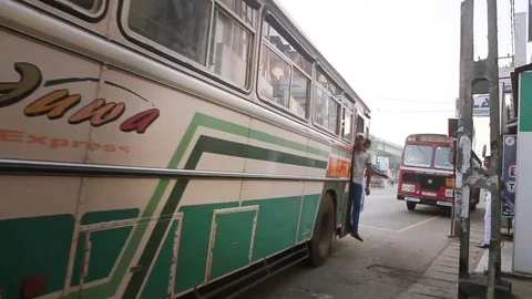 Regular public Sri Lankan bus stop. Children students go to school Stock Footage 83560162