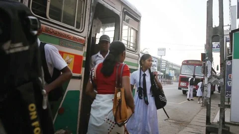 Regular public Sri Lankan bus stop. Children students go to school Stock Footage 83618017