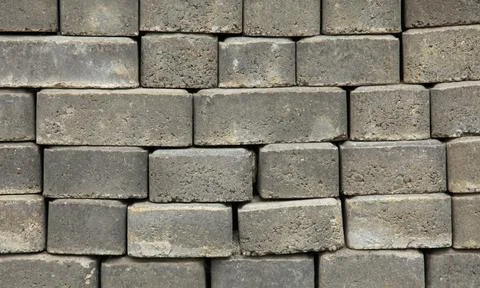 Regular shape blocks, texture, background. Paving slabs of gray blocks Stock Photos