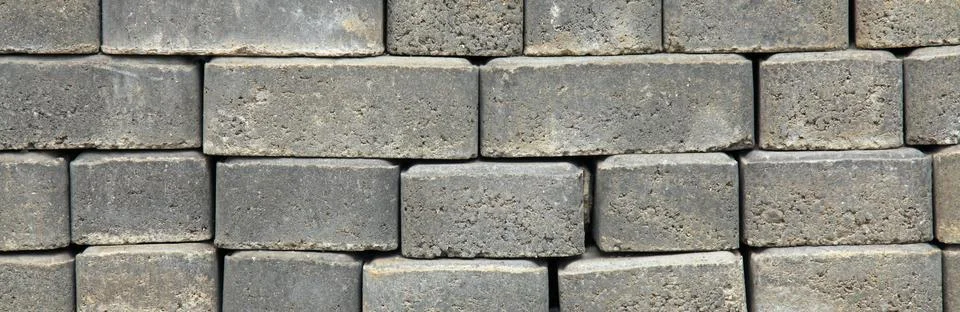 Regular shape blocks, texture, background. Paving slabs of gray blocks Stock Photos