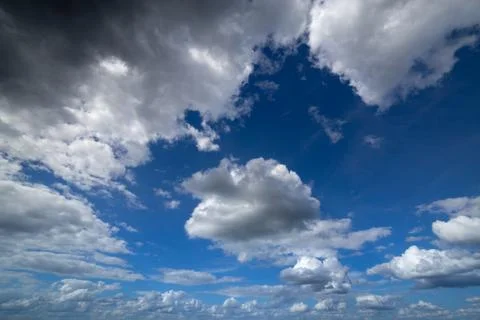 Regular spring clouds on blue sky at daylight in continental europe. Close shot Stock Photos