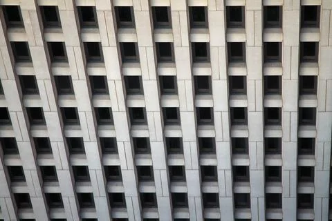 The regular windows pattern in a concrete building Stock Photos