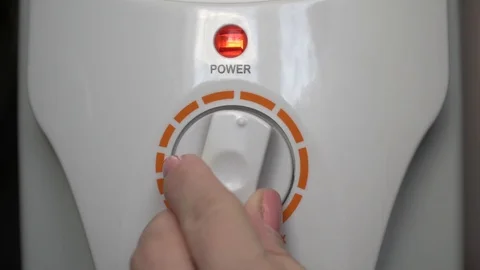 Regulating power level. Red indicator light switching on and off Stock Footage 96104203