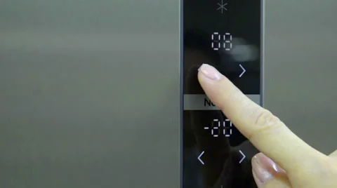 Regulating the temperature on a fridge Stock Footage 55784040