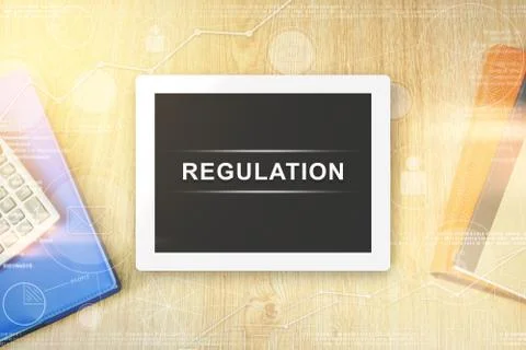 Regulation word on tablet Stock Photos