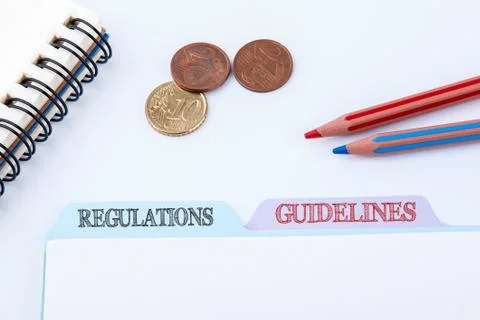 Regulations and Guidelines. Folder Register on a white Office Table Stock Photos