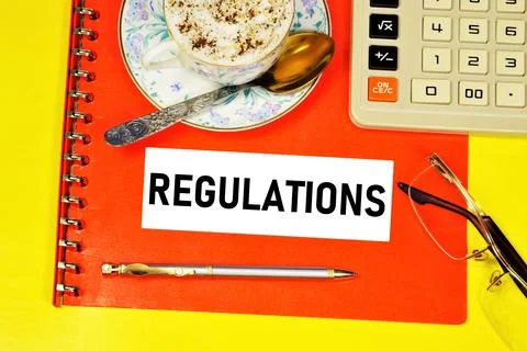 Regulations. A text inscription in a folder with documents Stock Photos
