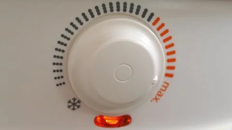 Regulator of temperature of heating water in boiler.Red light indicator comes on Stock Footage 319445245
