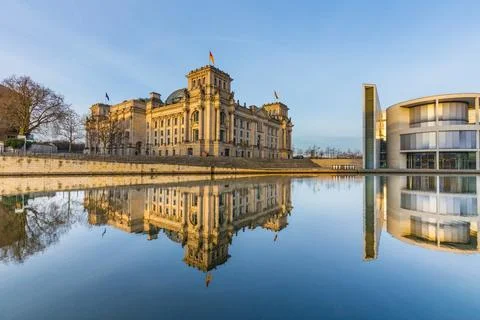 Reichstag with reflection in river Spree Stock Photos
