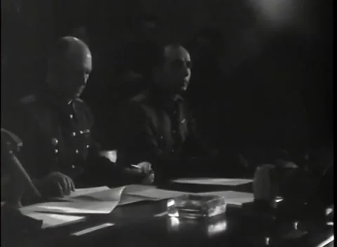 REIMS - 1945: German surrender signing - Officer holds pen over documents Stock Footage 343791270