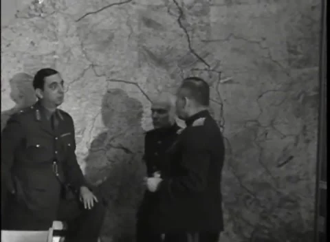REIMS - 1945: German surrender signing - Allied officers study wall map Stock Footage 343791272